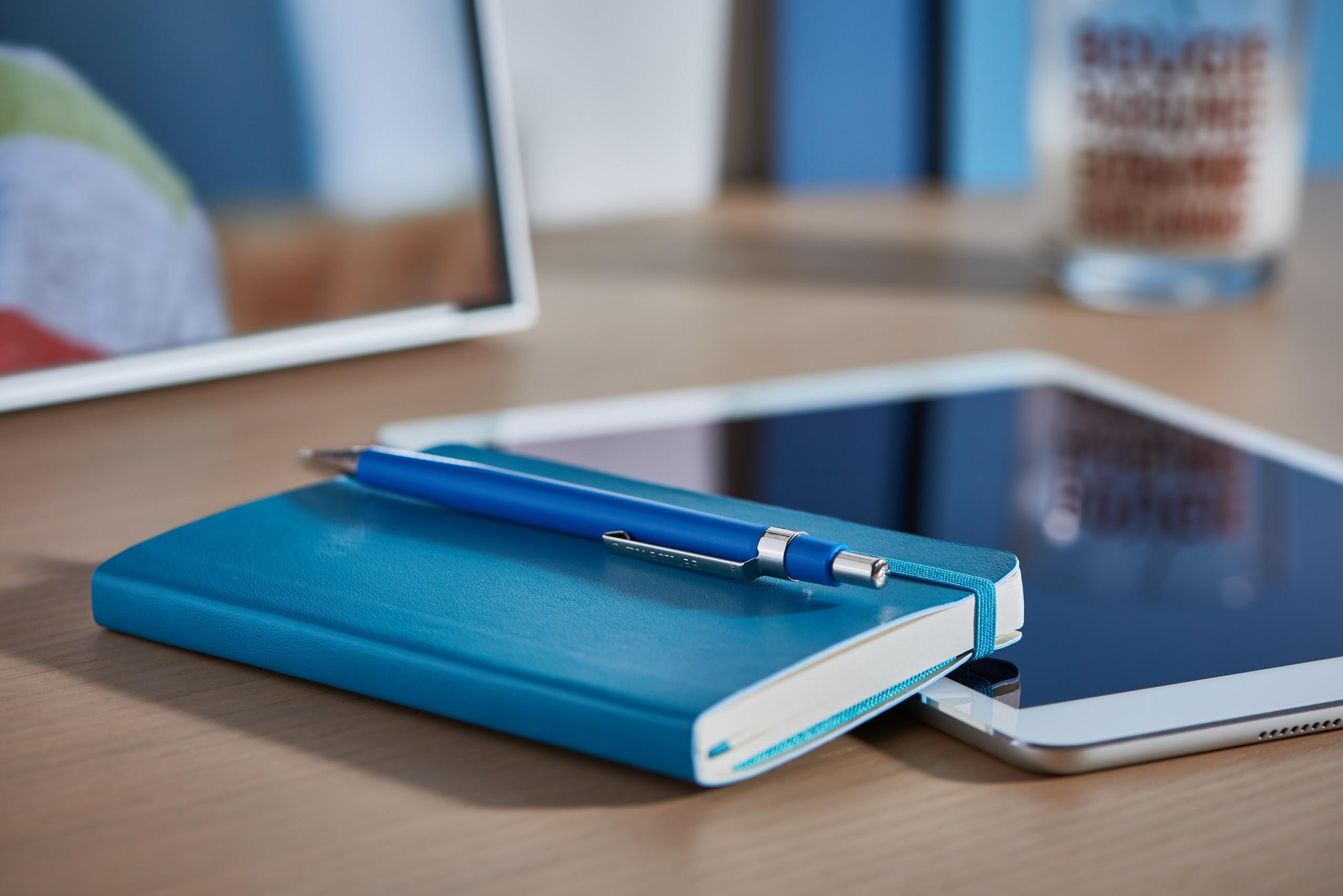 Notebook, pen, and tablet from the original Loyal Permit Solutions website